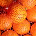 Polyethylene netting on oranges